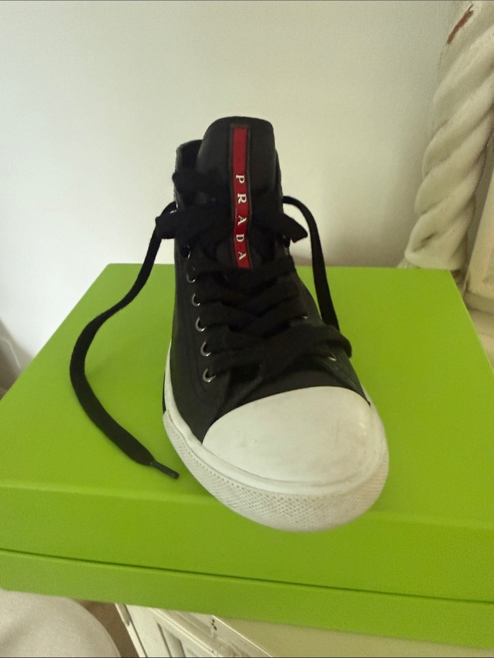 Prada Black High-Top Sneaker with Red Tongue Stripe